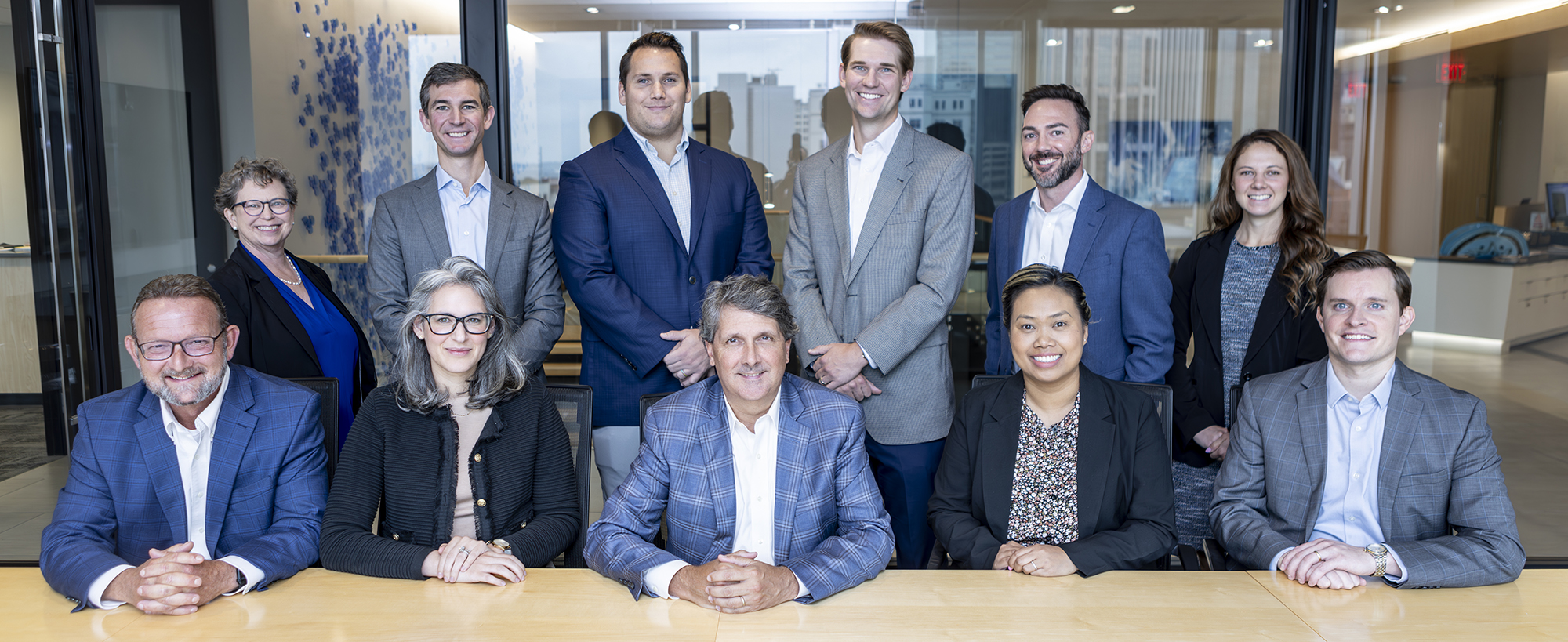 Capital Markets associates at a table facing the camera.