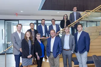 PNFP Capital Markets team assembled on a staircase